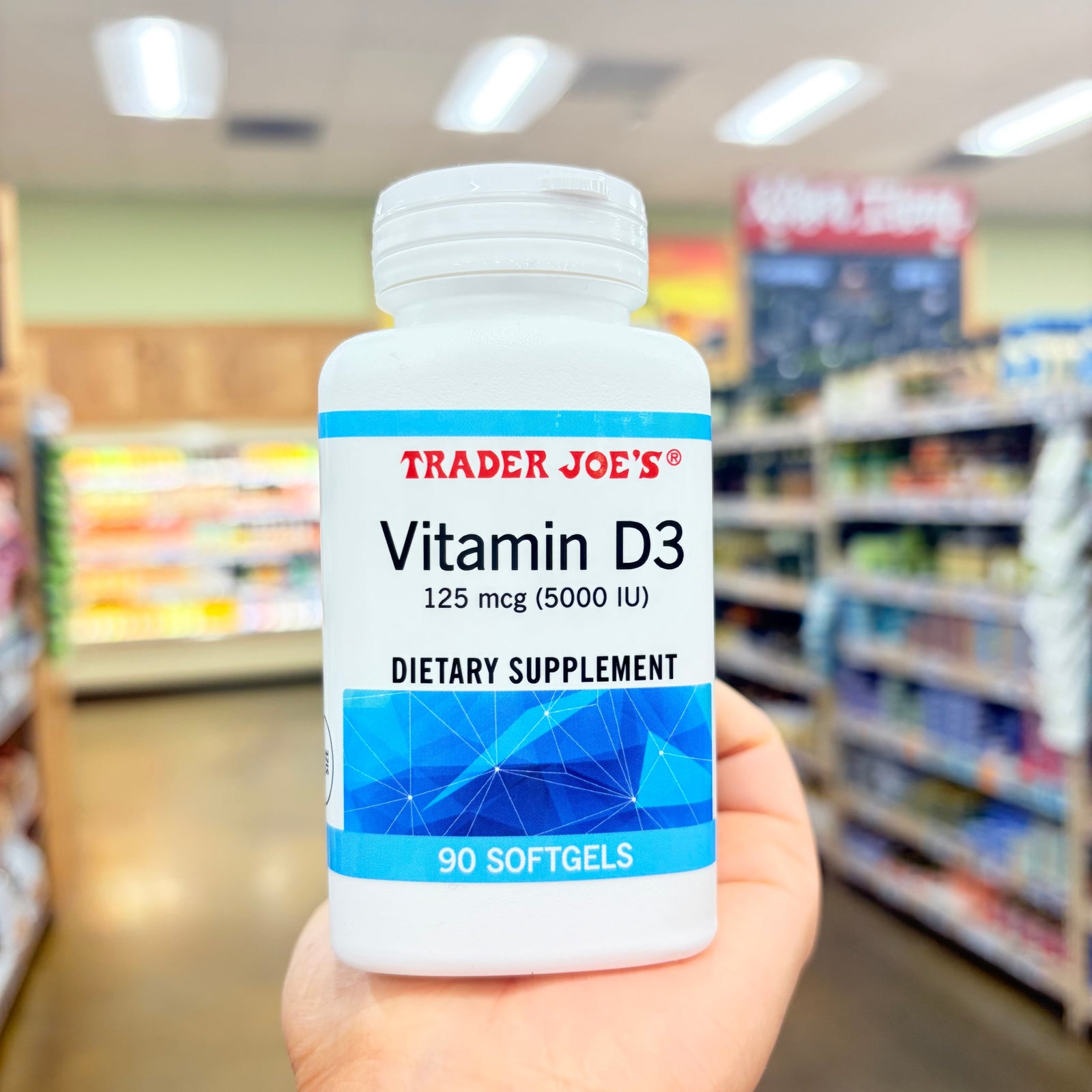 Trader Joe's Vitamin D3 125 mcg 5000 IU Dietary Supplement 90 Softgels bottle on a light surface