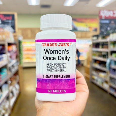 Trader Joe's Women's Once Daily High Potency Multivitamin Multimineral 60 Tablets bottle on a light surface