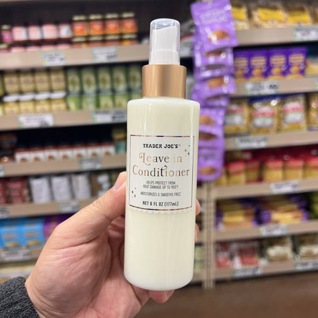 Trader Joe's Leave-In Conditioner 6 fl oz bottle on a white surface