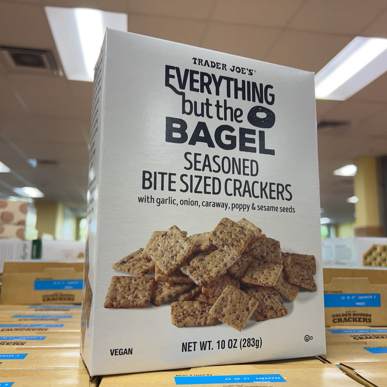 Angled front view of Trader Joe's Everything but the Bagel Seasoned Bite Sized Crackers 10 oz
