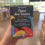 Trader Joe's Papua New Guinea Small Lot Coffee — third front view in different store lighting, showing 100% Arabica Whole Bean Coffee, Light Roast, notes of pineapple & brown sugar, net wt 12 oz (340g), Kosher Pareve (KSA)