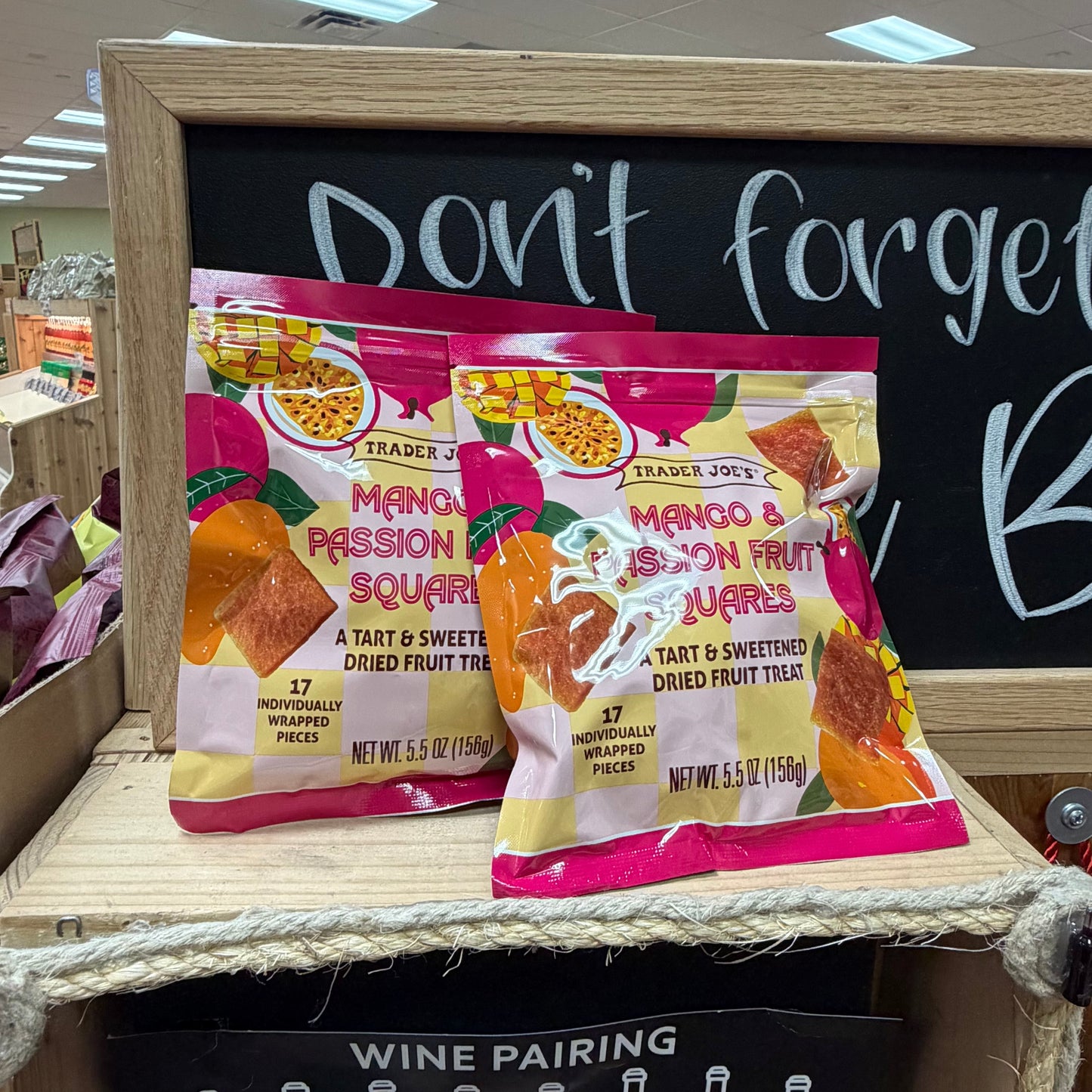 Trader Joe's Mango & Passion Fruit Squares held in hand at Trader Joe's store