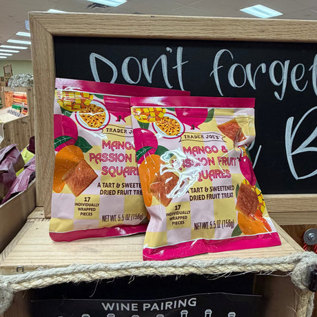 Trader Joe's Mango & Passion Fruit Squares held in hand at Trader Joe's store