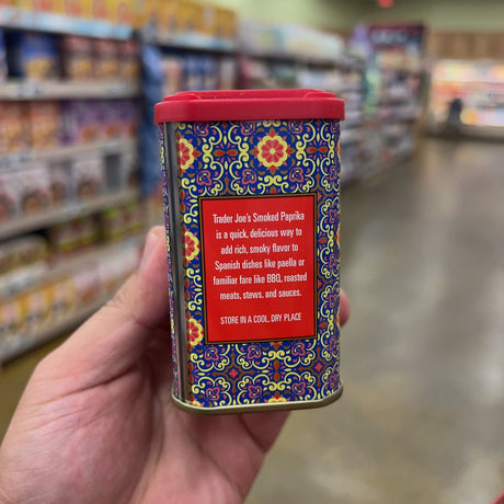 Trader Joe's Smoked Paprika tin back panel: Trader Joe's Smoked Paprika is a quick delicious way to add rich smoky flavor to Spanish dishes like paella or familiar fare like BBQ roasted meats stews and sauces, Store in a cool dry place
