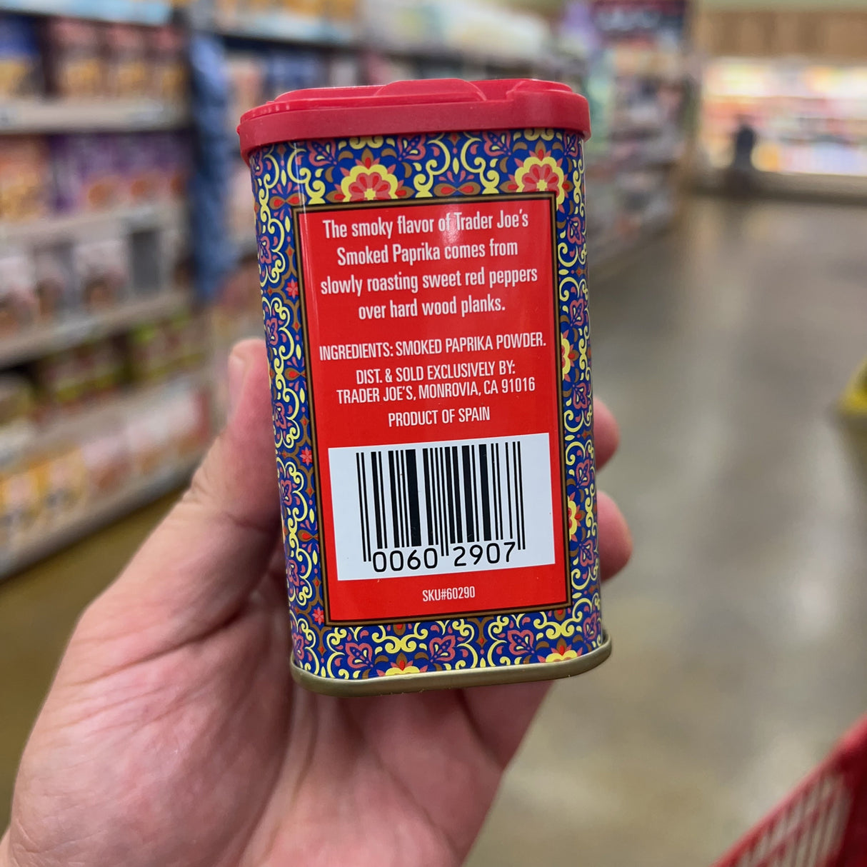 Trader Joe's Smoked Paprika tin side panel: the smoky flavor comes from slowly roasting sweet red peppers over hard wood planks, Ingredients Smoked Paprika Powder, Dist. Sold Exclusively by Trader Joe's Monrovia CA 91016, Product of Spain, barcode 00602907, SKU 60290