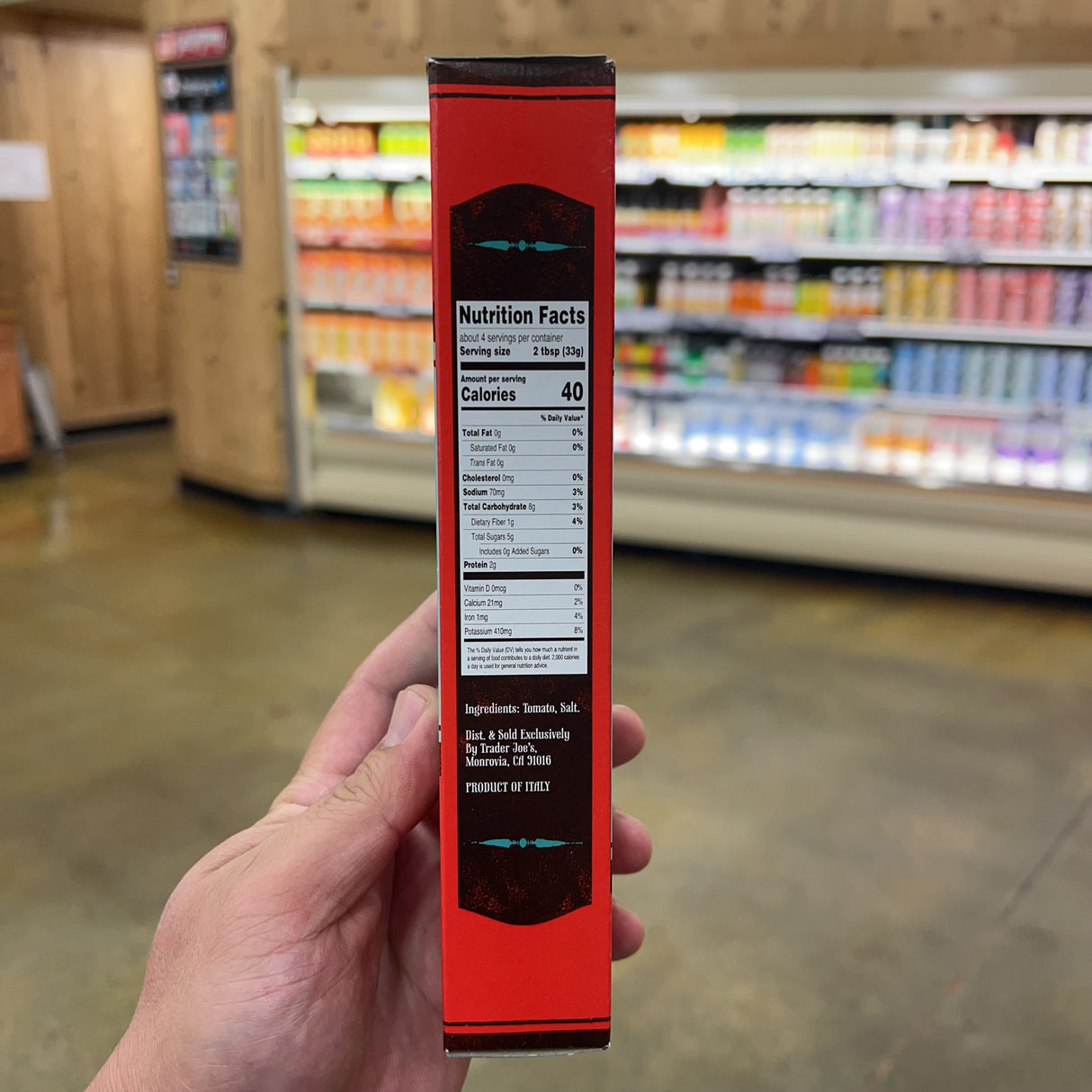 Trader Giotto's Italian Tomato Paste nutrition facts panel: serving size 2 tbsp 33g, about 4 servings, 40 calories, total fat 0g, sodium 70mg, total carbohydrate 8g, dietary fiber 1g, total sugars 5g, protein 2g, calcium 21mg, iron 1mg, potassium 410mg, ingredients tomato salt, Dist. Sold Exclusively by Trader Joe's Monrovia CA 91016, Product of Italy