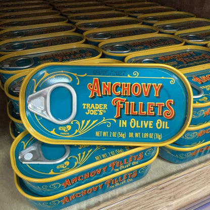 Trader Joe's Anchovy Fillets in Olive Oil tins on store shelf