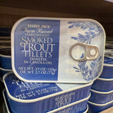 Trader Joe's Hardwood Smoked Trout Fillets tins displayed on store shelf