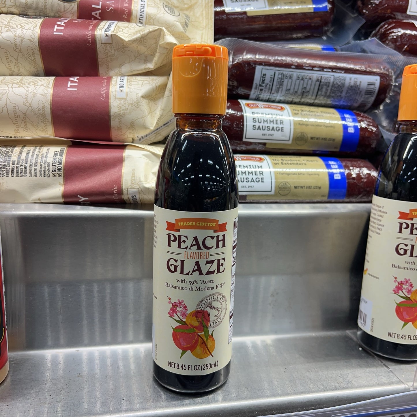 Trader Joe's Peach Flavored Glaze 8.45 fl oz bottle on store shelf