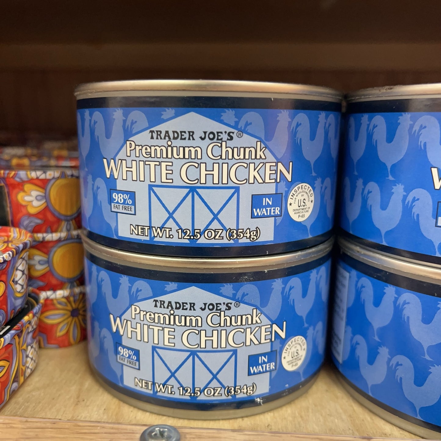 Trader Joe's Premium Chunk White Chicken 12.5 oz cans on store shelf
