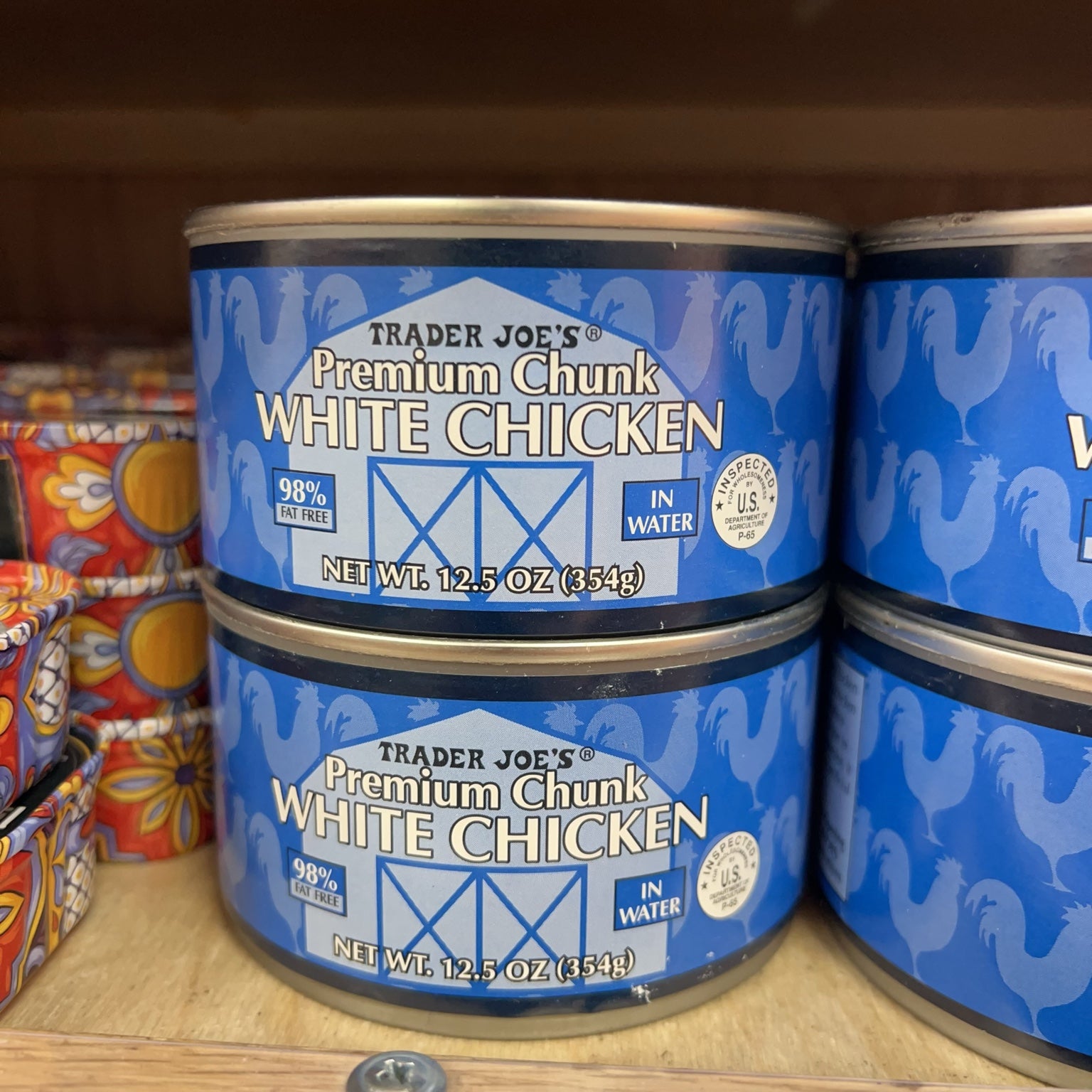 Trader Joe's Premium Chunk White Chicken 12.5 oz cans on store shelf