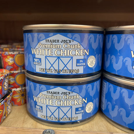 Trader Joe's Premium Chunk White Chicken 12.5 oz cans on store shelf