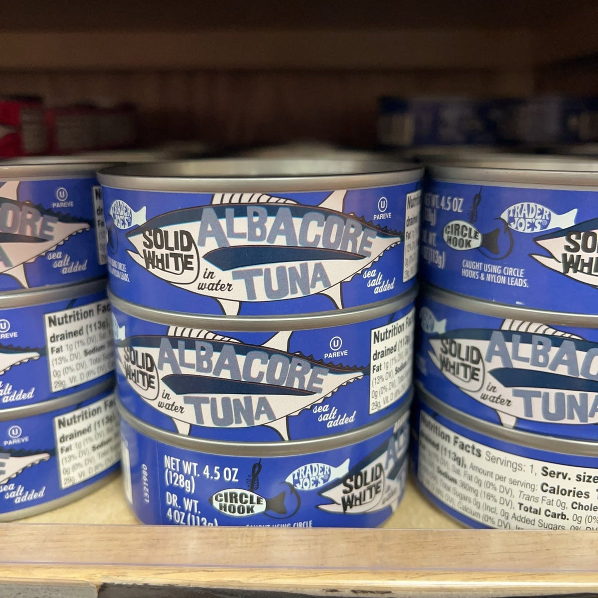 Trader Joe's Solid White Albacore Tuna in Water Sea Salt Added cans on store shelf