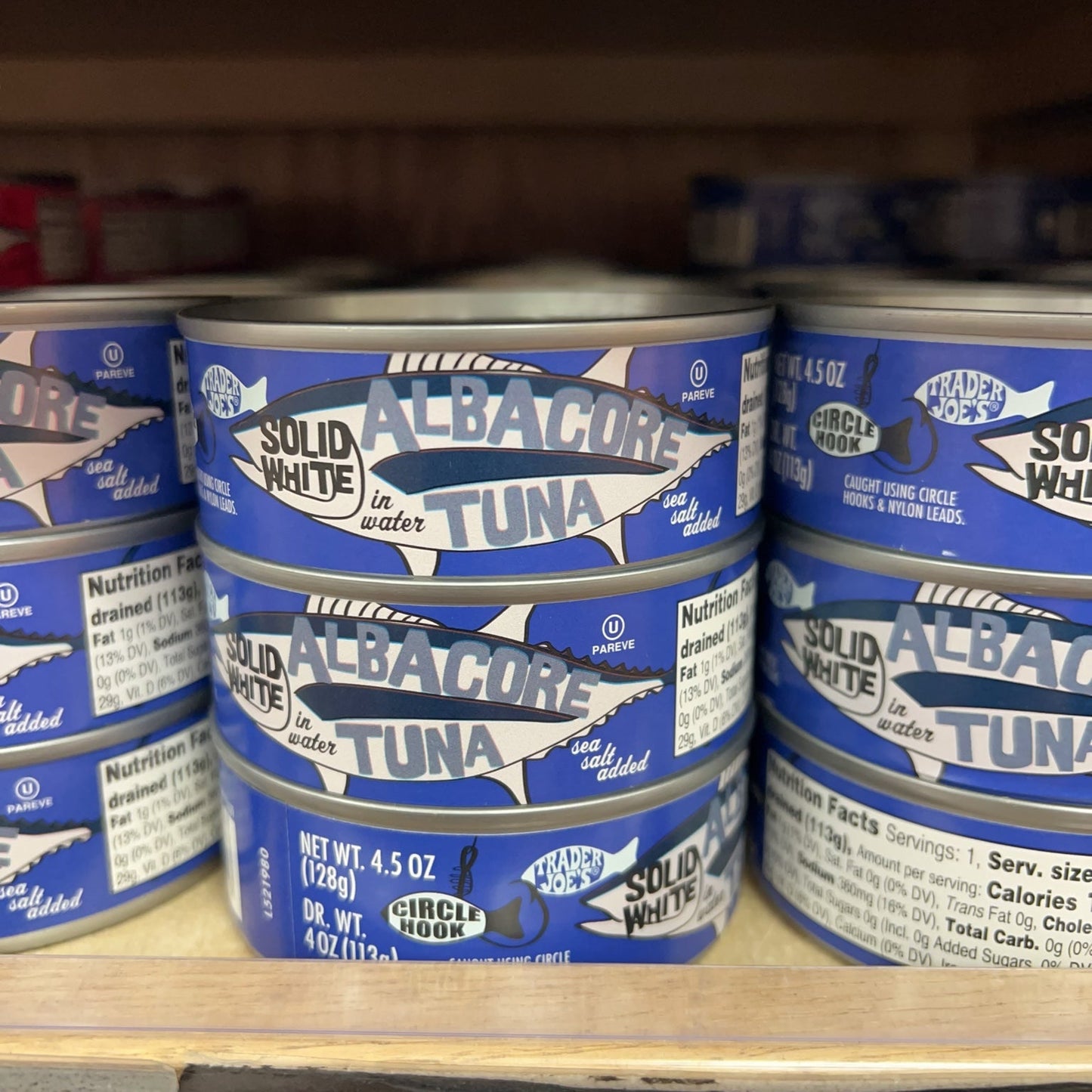 Trader Joe's Solid White Albacore Tuna in Water Sea Salt Added cans on store shelf
