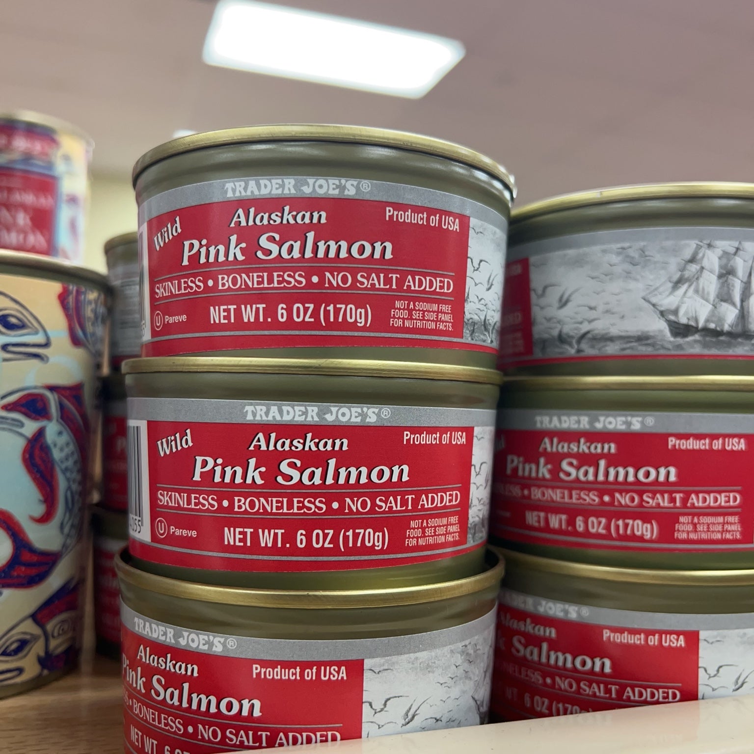 Trader Joe's Wild Alaskan Pink Salmon Skinless Boneless No Salt Added cans in store display